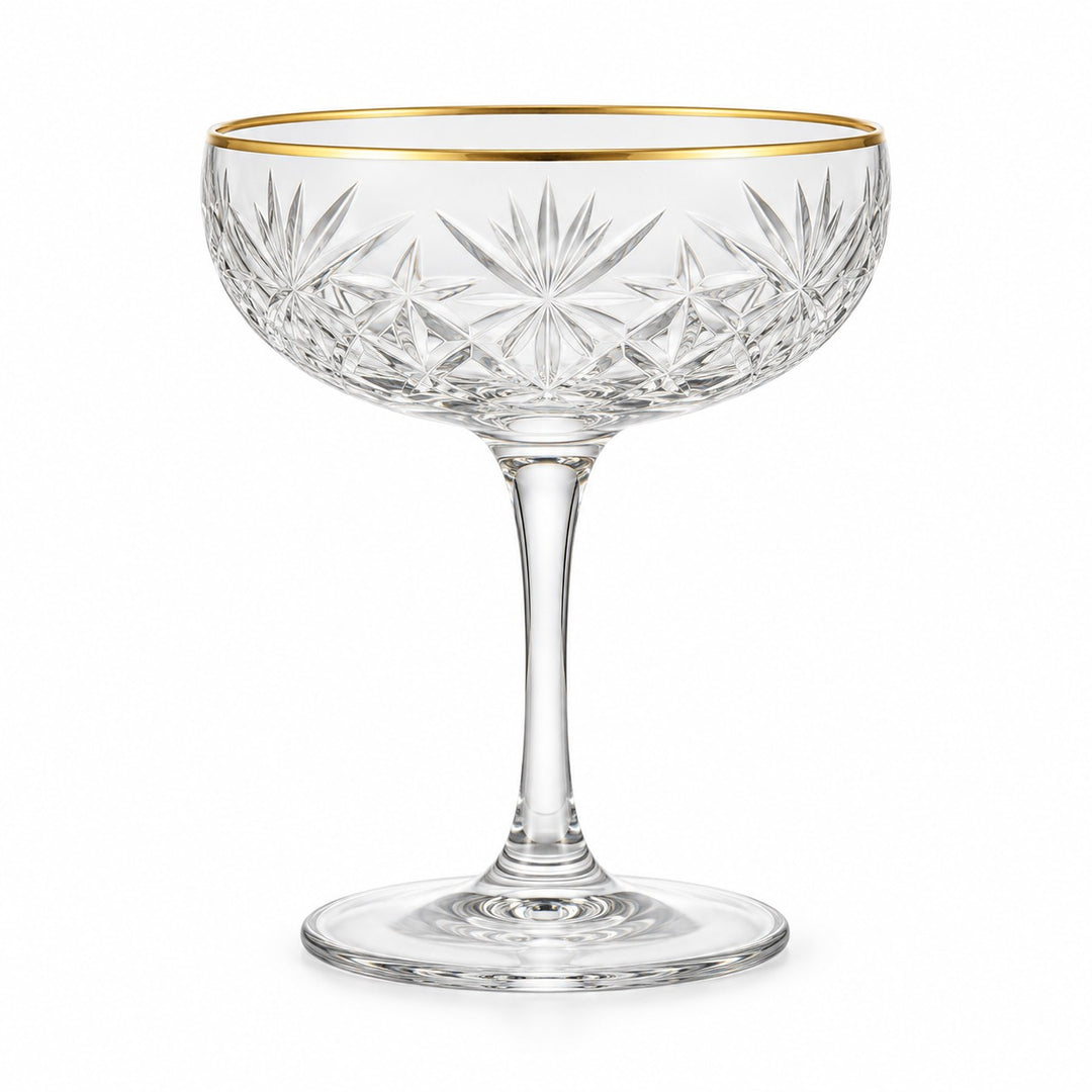One gold rim 255 ml coupe cocktail glass stands alone against a pure white background.