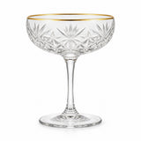 One gold rim 255 ml coupe cocktail glass stands alone against a pure white background.