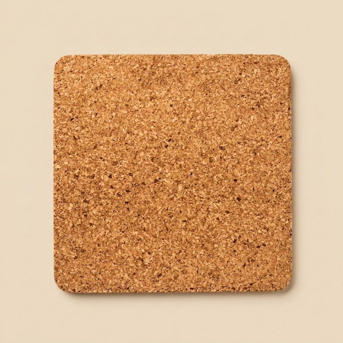 A square cork coaster with rounded corners, shown from a top-down view on a solid beige background.