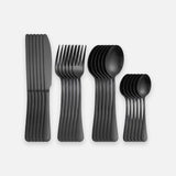 Six black knives, six forks, six tablespoons and six teaspoons form four overlapping groups on a white background.