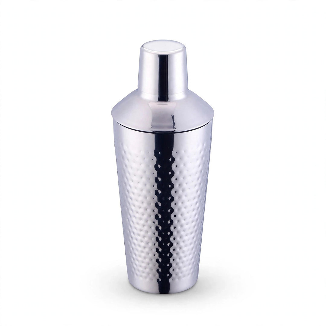 Single hammered silver stainless steel cocktail shaker with cap on a plain white background.