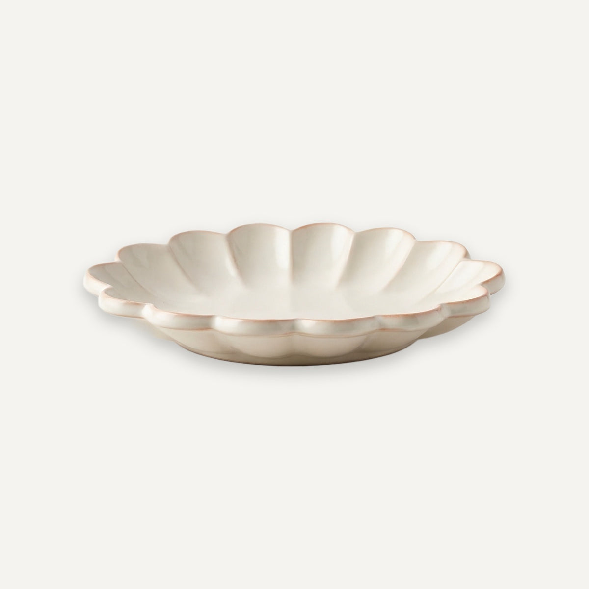 Brown flat shoe with a bow on a white background