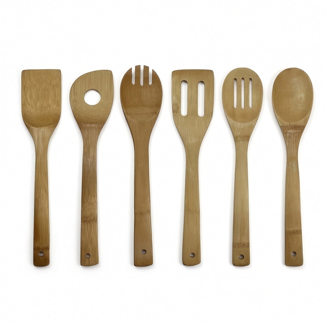 Six bamboo kitchen utensils, including a spatula, serving spoon, fork, slotted spoon, and ladle, arranged in a row on a white background.