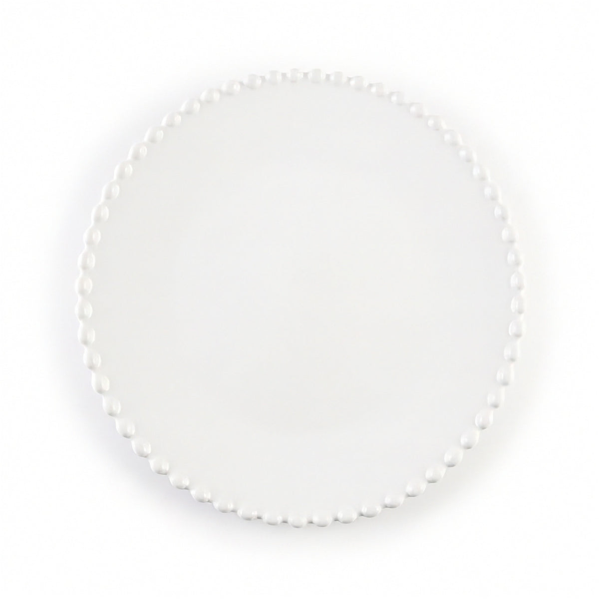 A round white plate with a delicate border of small white pearls, photographed from directly above on a clean white background.