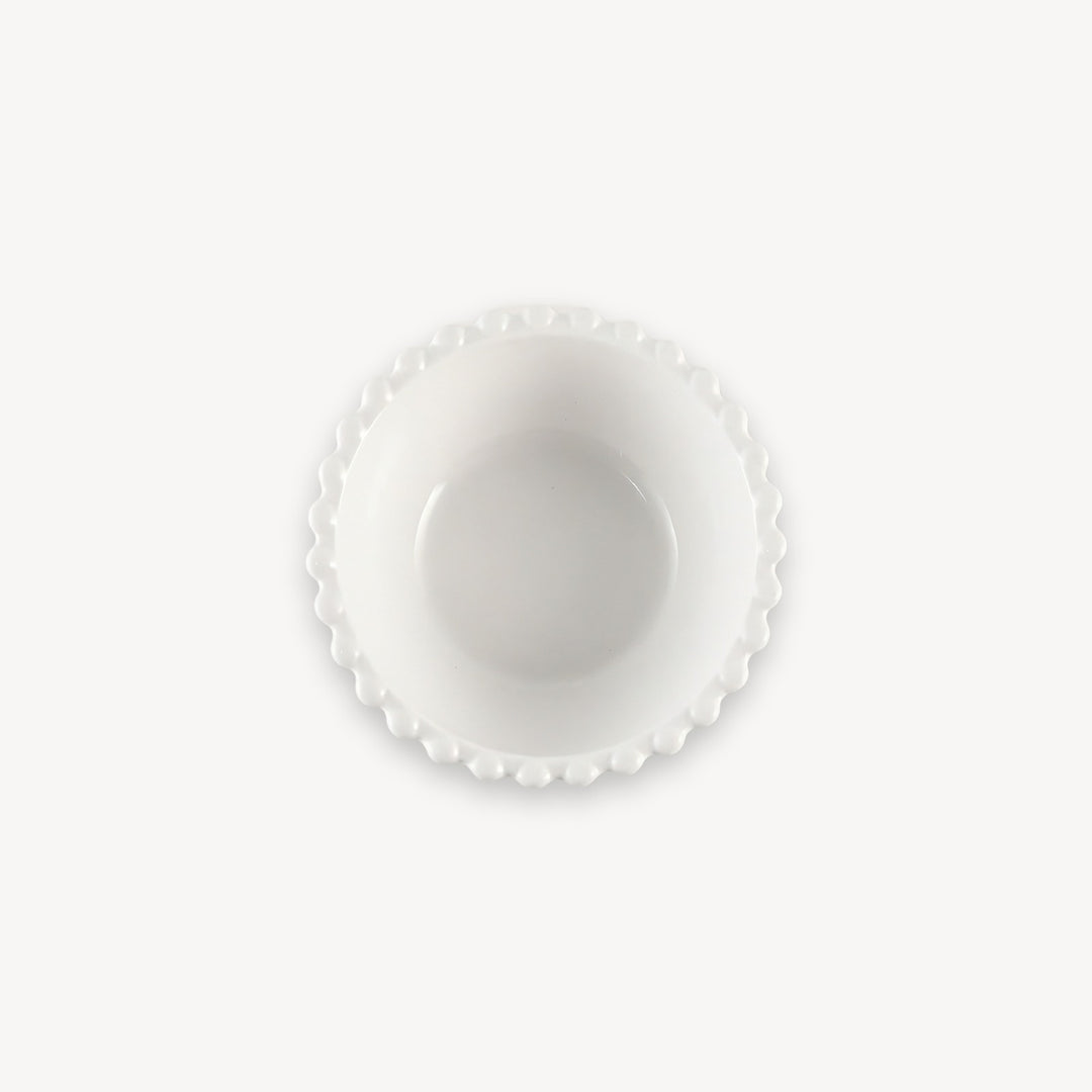 A white round bowl with a beaded rim and deep center is shown from above against a white background.