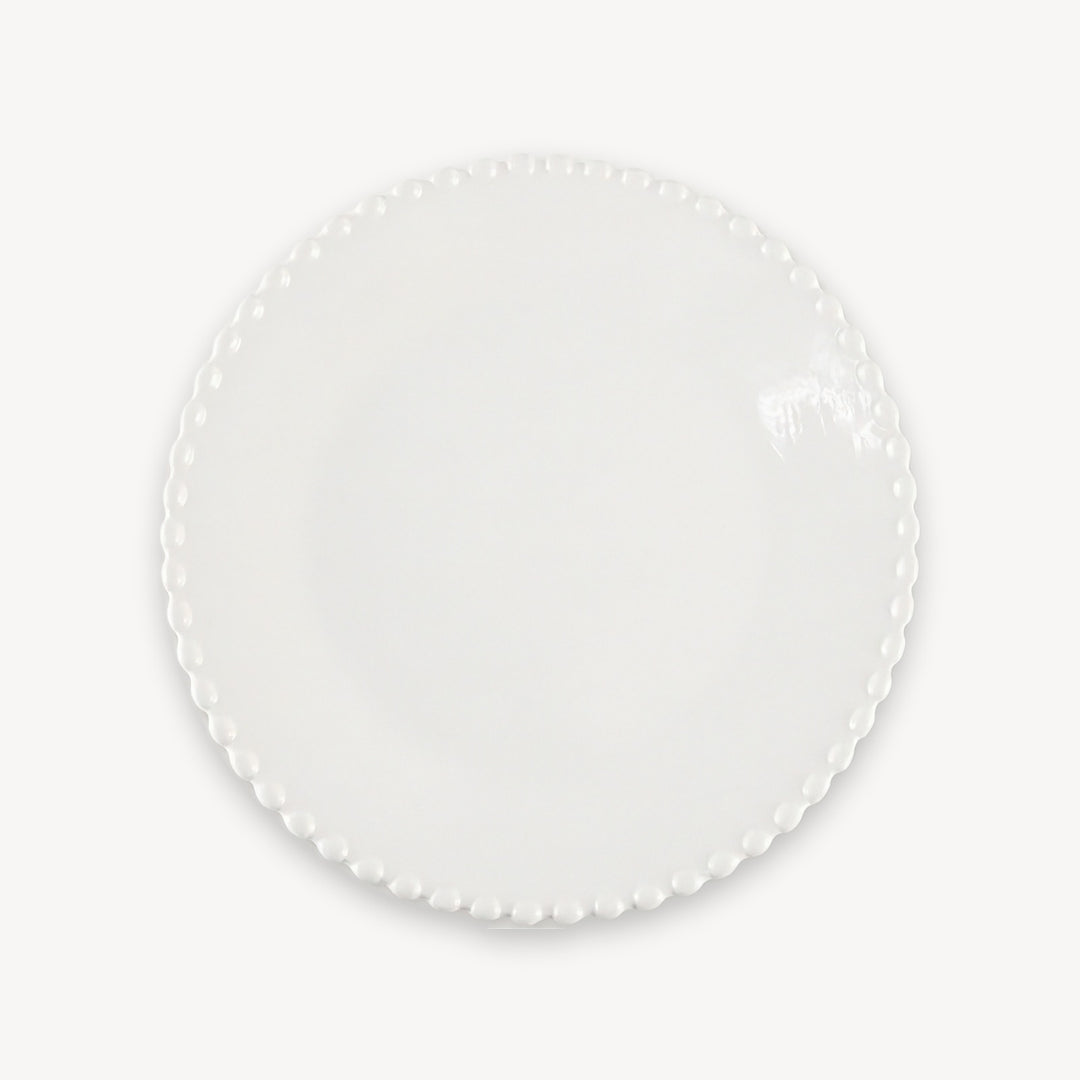 A glossy white round plate with a beaded rim is shown from above against a plain white background.