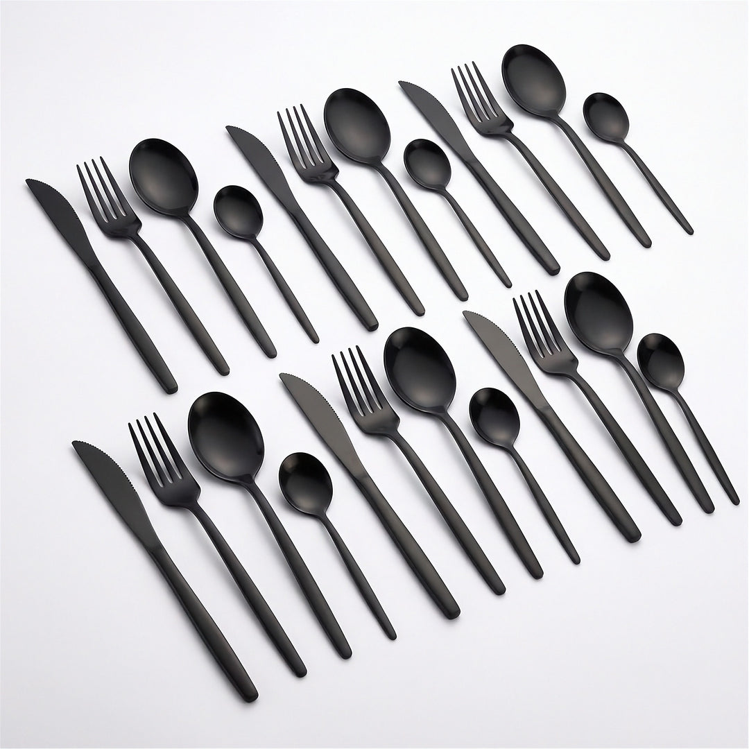 A set of matte black flatware, including knives, forks, spoons, and plastic cutlery, arranged neatly on a clean white background.