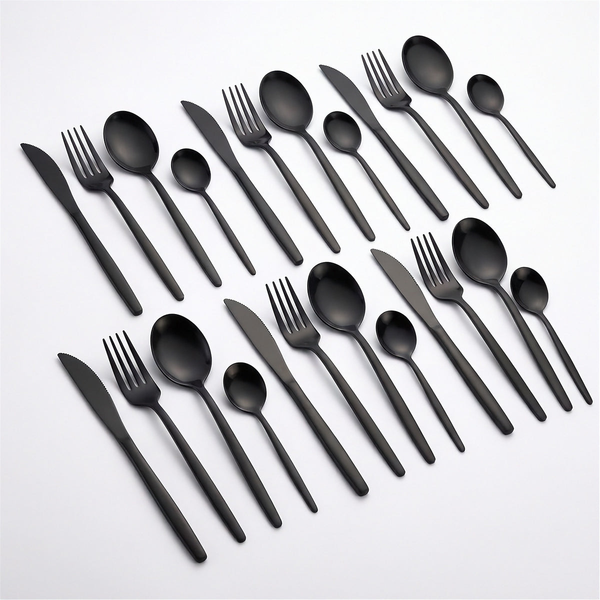 A set of matte black flatware, including knives, forks, spoons, and plastic cutlery, arranged neatly on a clean white background.