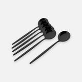 Five black ceramic spoons with long handles, arranged on a light gray background.