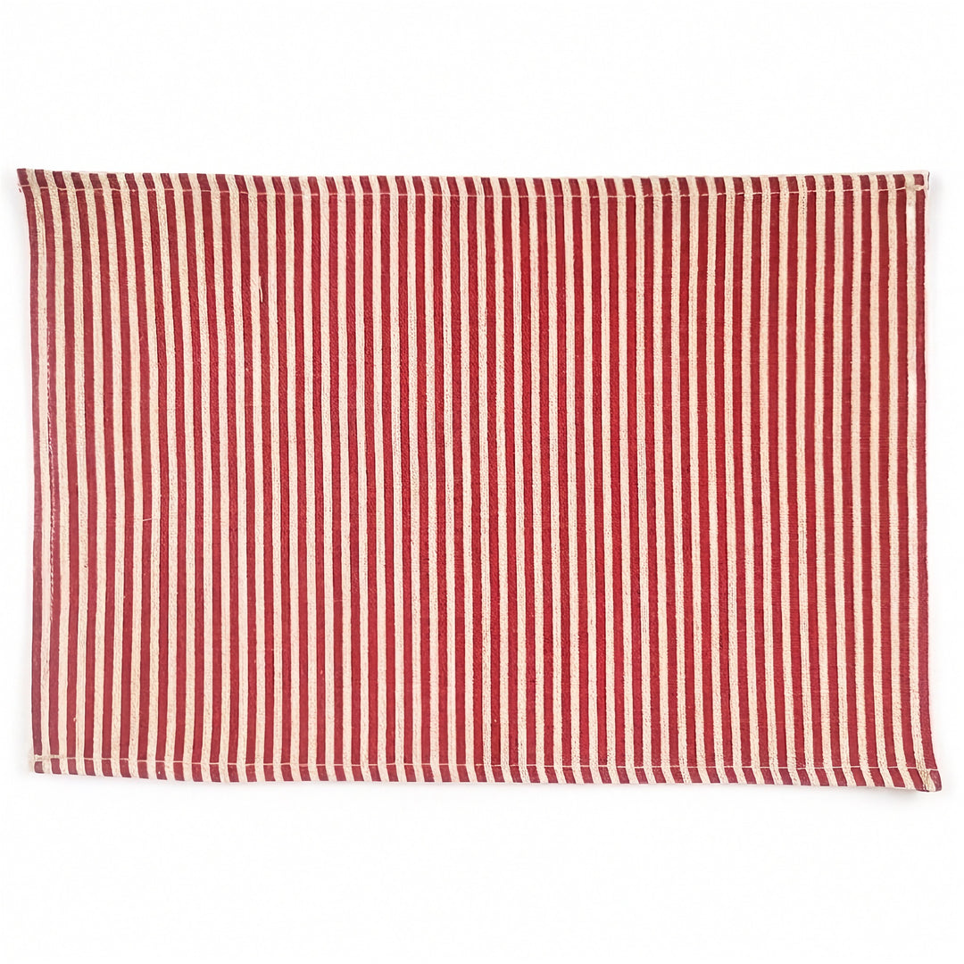 A rectangular woven placemat with vertical red and white stripes, shown flat against a plain white background.