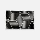 A rectangular black card holder or clutch featuring a white geometric pattern of intersecting lines and polygons, shown against a light gray background.