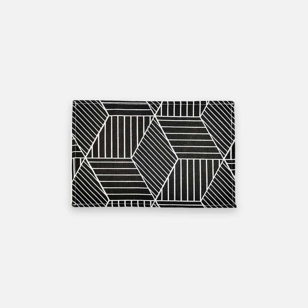 A rectangular product featuring a black and white geometric pattern of intersecting lines forming faceted polygon shapes, shown against a light gray background.