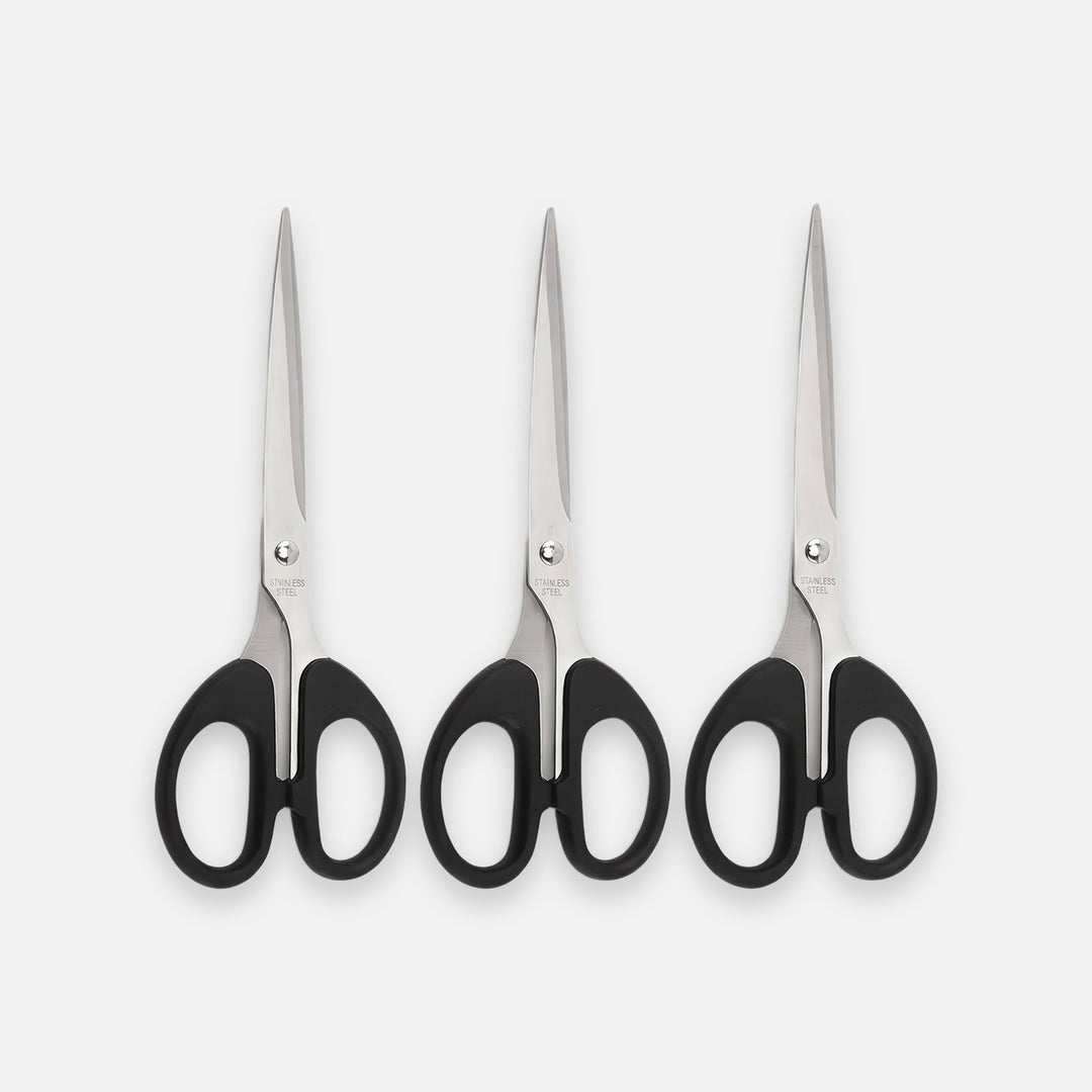 Three pairs of hair shears with black handles and silver stainless steel blades, arranged side-by-side on a light gray background.