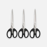 Three pairs of hair shears with black handles and silver stainless steel blades, arranged side-by-side on a light gray background.