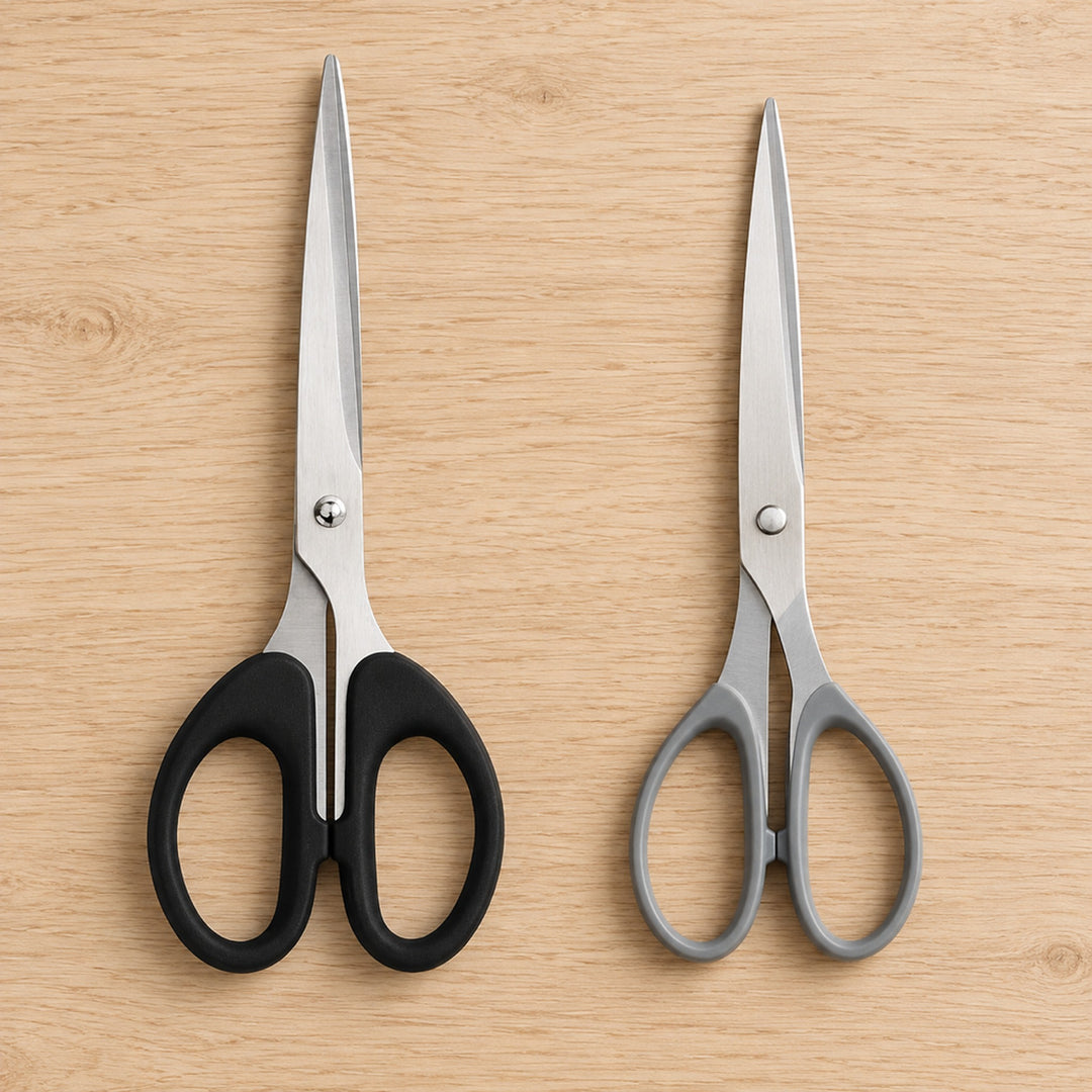 Comparison of the black soft-grip stainless steel scissors next to a basic pair with thin grey plastic loops