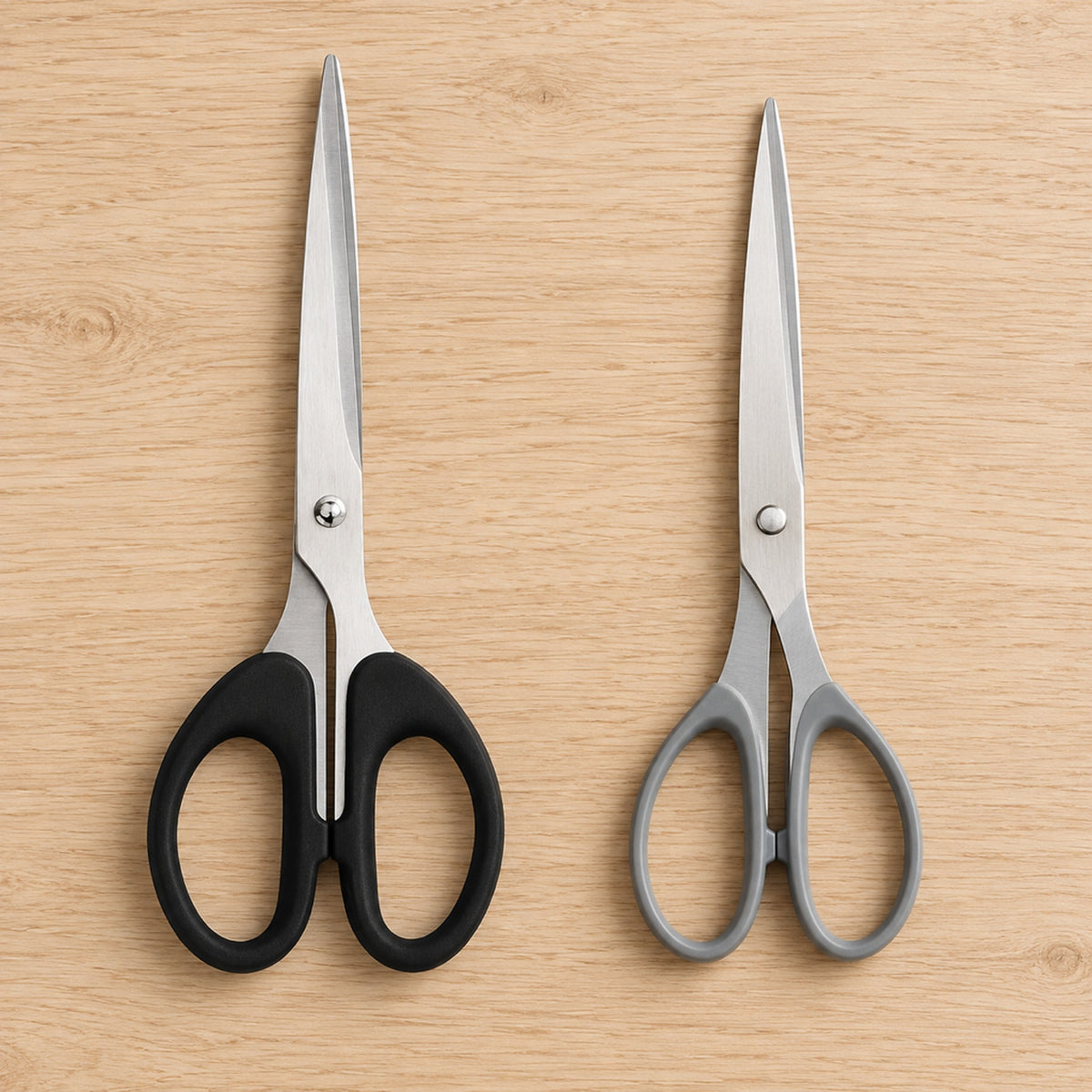 Comparison of the black soft-grip stainless steel scissors next to a basic pair with thin grey plastic loops