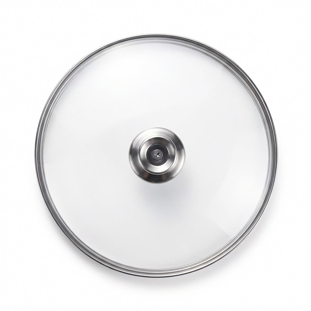 Clear glass cookware lid with a brushed stainless steel rim and a central silver metal knob, shown from a top-down view on a white background.