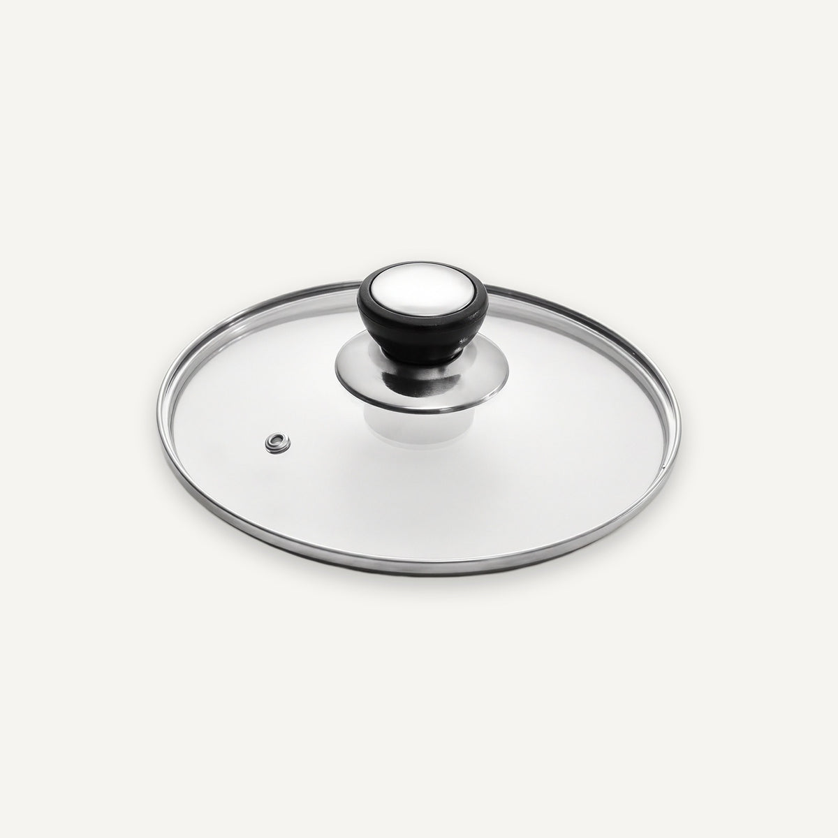 A clear glass lid with a polished silver metal rim and a black-and-white knob, shown on a light gray background.