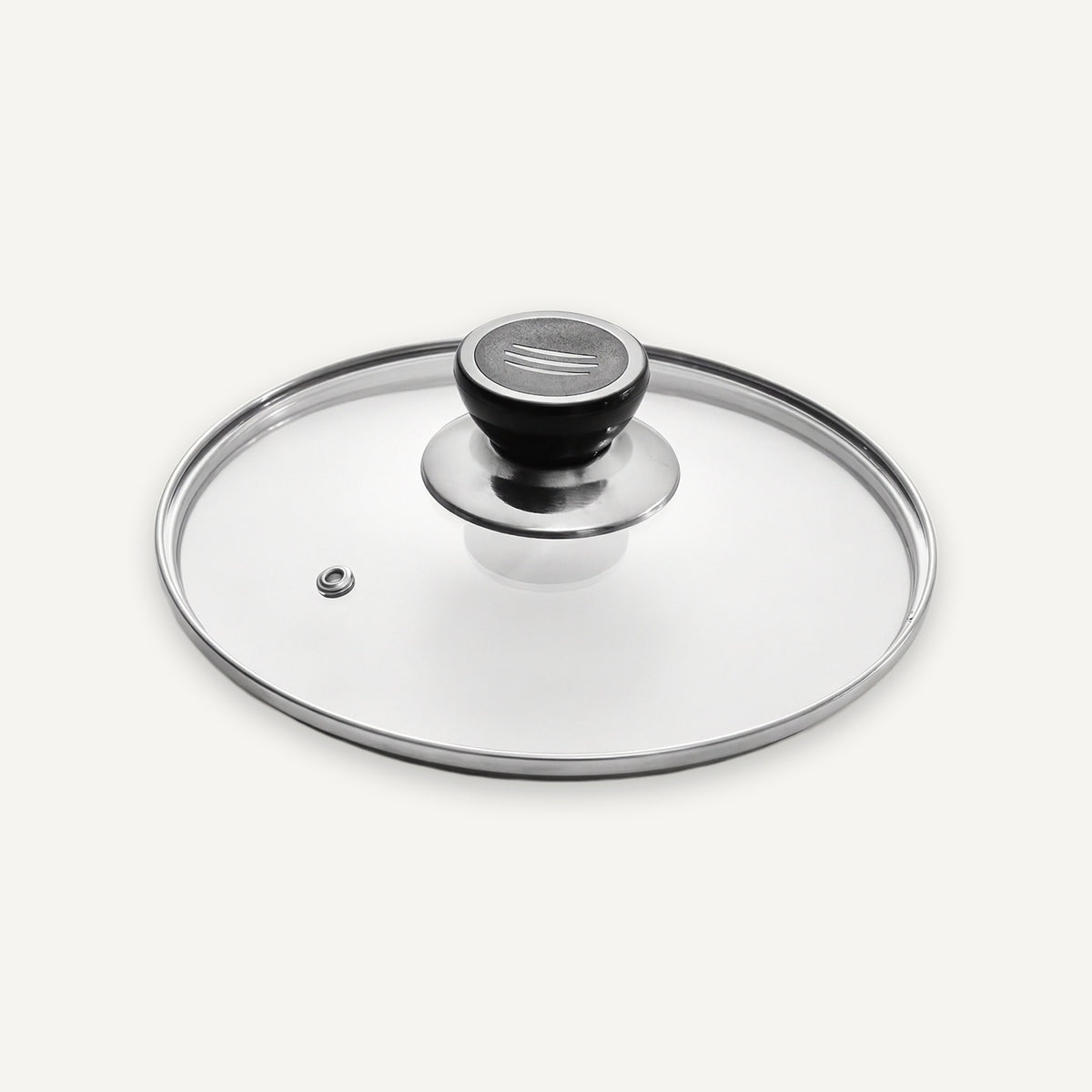 A clear glass lid with a polished silver metal rim and a black knob, photographed on a clean off-white background.