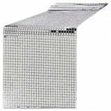 A silver disco ball mesh table runner with a reflective grid pattern, shown partially unrolled on a white background.