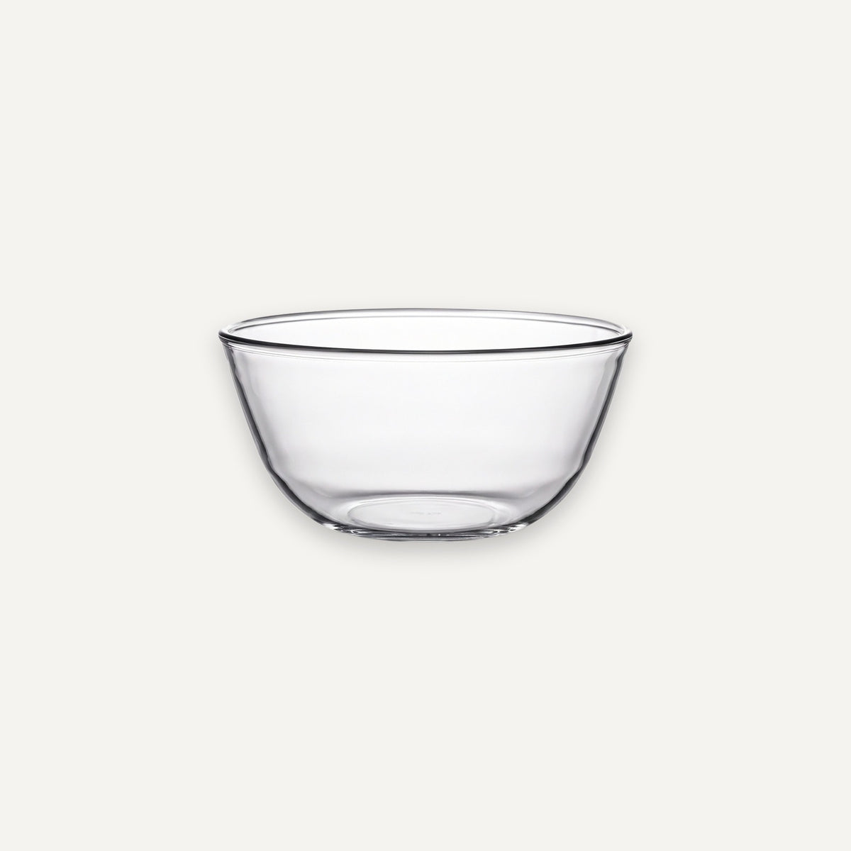 A clear glass bowl with a wide rim and slightly tapered base, shown against a plain light gray background.
