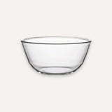 A clear glass mixing bowl with a wide rim and slightly tapered base, shown on a plain light gray background.