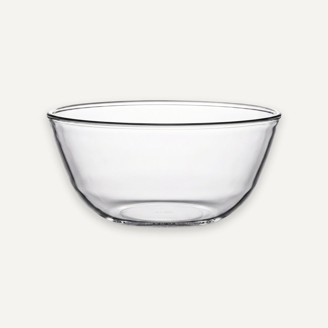A clear glass bowl with a wide rim and slightly tapered sides, shown against a plain light gray background.
