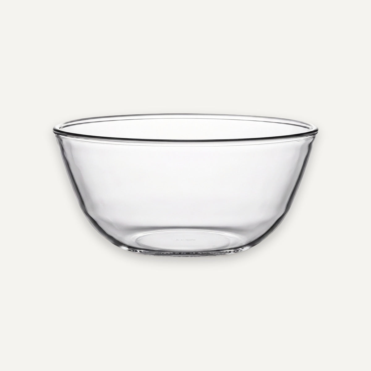 A clear glass bowl with a wide rim and slightly tapered sides, shown against a plain light gray background.