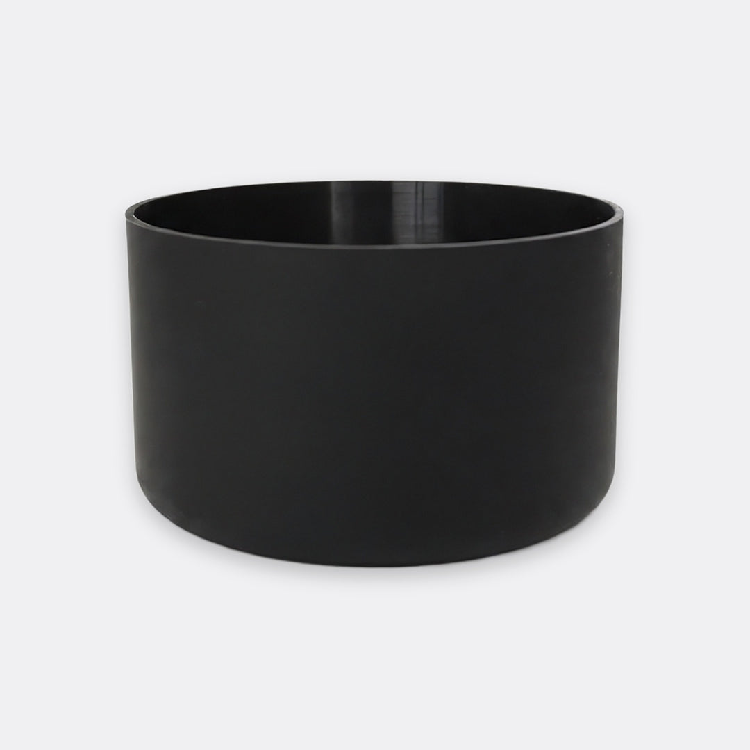 A matte black cylindrical planter pot with a wide rim, shown on a light gray background.