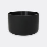 A matte black cylindrical planter pot with a wide rim, shown on a light gray background.