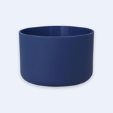 A matte navy blue cylindrical bowl or planter with a smooth finish, shown against a light gray background.