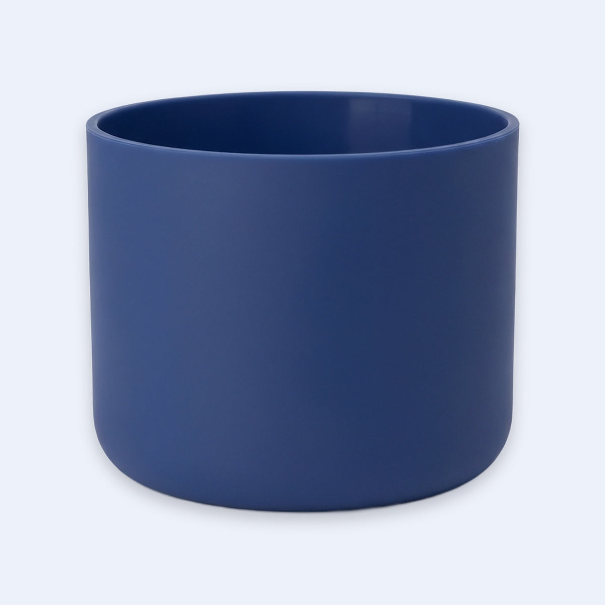 A matte navy blue cylindrical planter pot on a light gray background.