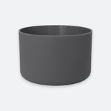 A dark gray cylindrical planter pot with a matte finish, shown against a light gray background.