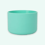 A mint green cylindrical cup or small planter with a matte finish, shown against a solid off-white background.