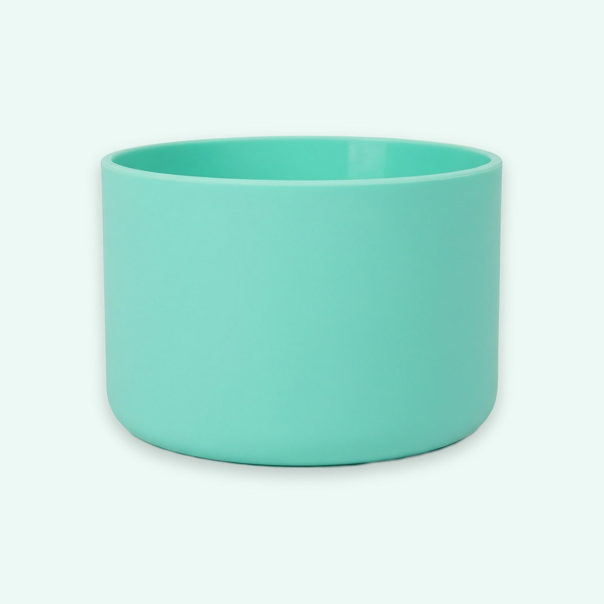 A mint green cylindrical cup or small planter with a matte finish, shown against a solid off-white background.