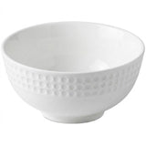 A white ceramic bowl with a textured, dimpled pattern around the outer side, shown on a plain white background.