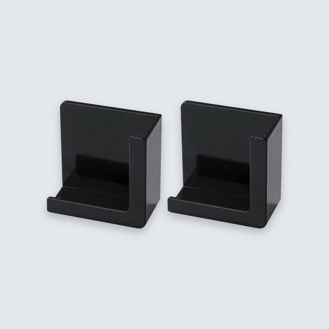 Two black plastic card holders or display stands shown side by side on a light gray background.
