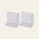 Two clear plastic card holders or display stands shown on a plain light beige background.