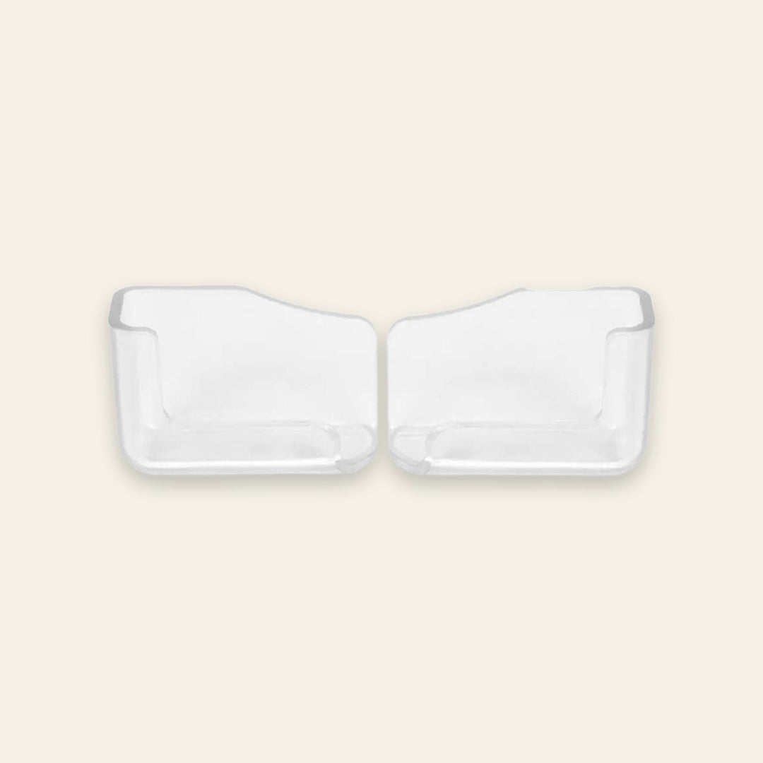 Two clear plastic refrigerator door pocket inserts shown side by side on a light beige background.