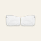 Two clear plastic refrigerator door pocket inserts shown side by side on a light beige background.