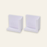 Two white plastic wall-mounted display holders shown side by side on a plain off-white background.