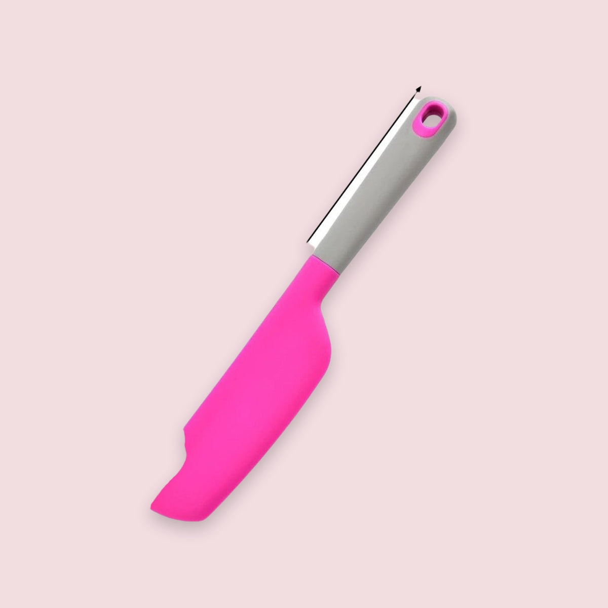 A bright pink spatula with a grey handle and pink hanging hole lies diagonally on pale pink beside a black arrow.