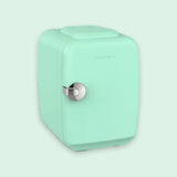 A mint green portable mini refrigerator with a silver handle and the brand name 'CROWNFUL' printed on the front, set against a matching light mint green background.