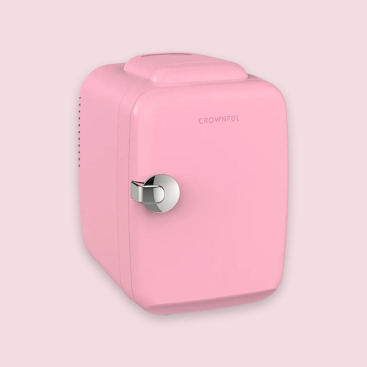 A retro-style pink mini refrigerator with a silver metal handle and the brand name 'CROWNFUL' printed on the front, set against a solid pale pink background.