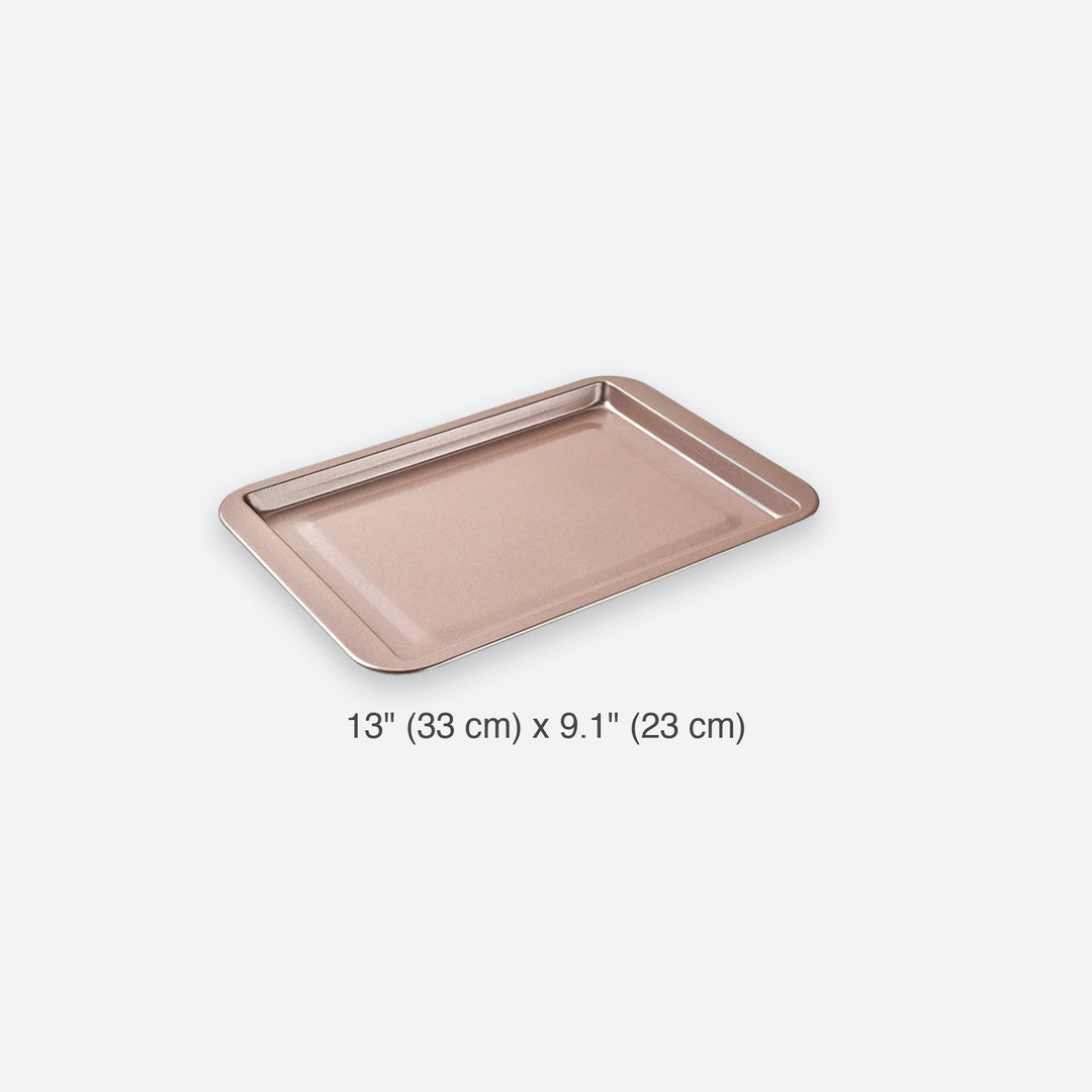 Rose-coloured baking tray on a white background with a size label reading 13 × 9.1 inches (33 × 23 cm).