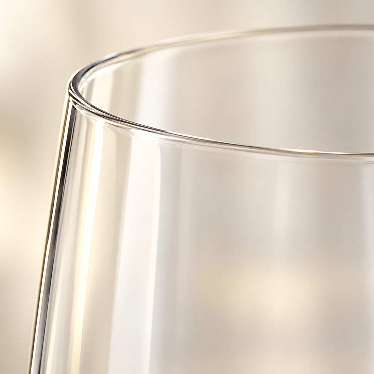 Close-up of the thin, smooth rim of a clear Tritan plastic champagne flute
