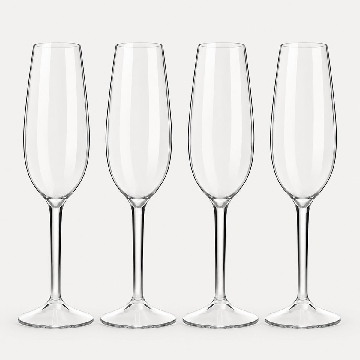 Set of 4 rounded clear Tritan plastic champagne flutes on a light warm grey backdrop