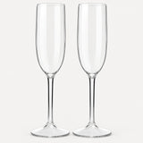 Set of 2 straight-sided clear Tritan plastic champagne flutes on a light warm grey backdrop