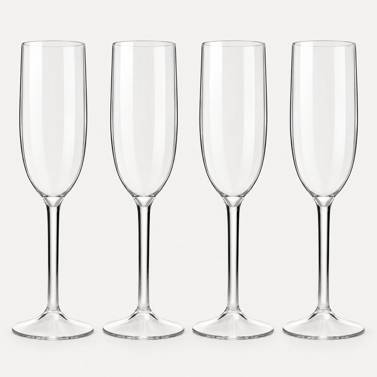 Set of 4 straight-sided clear Tritan plastic champagne flutes on a light warm grey backdrop