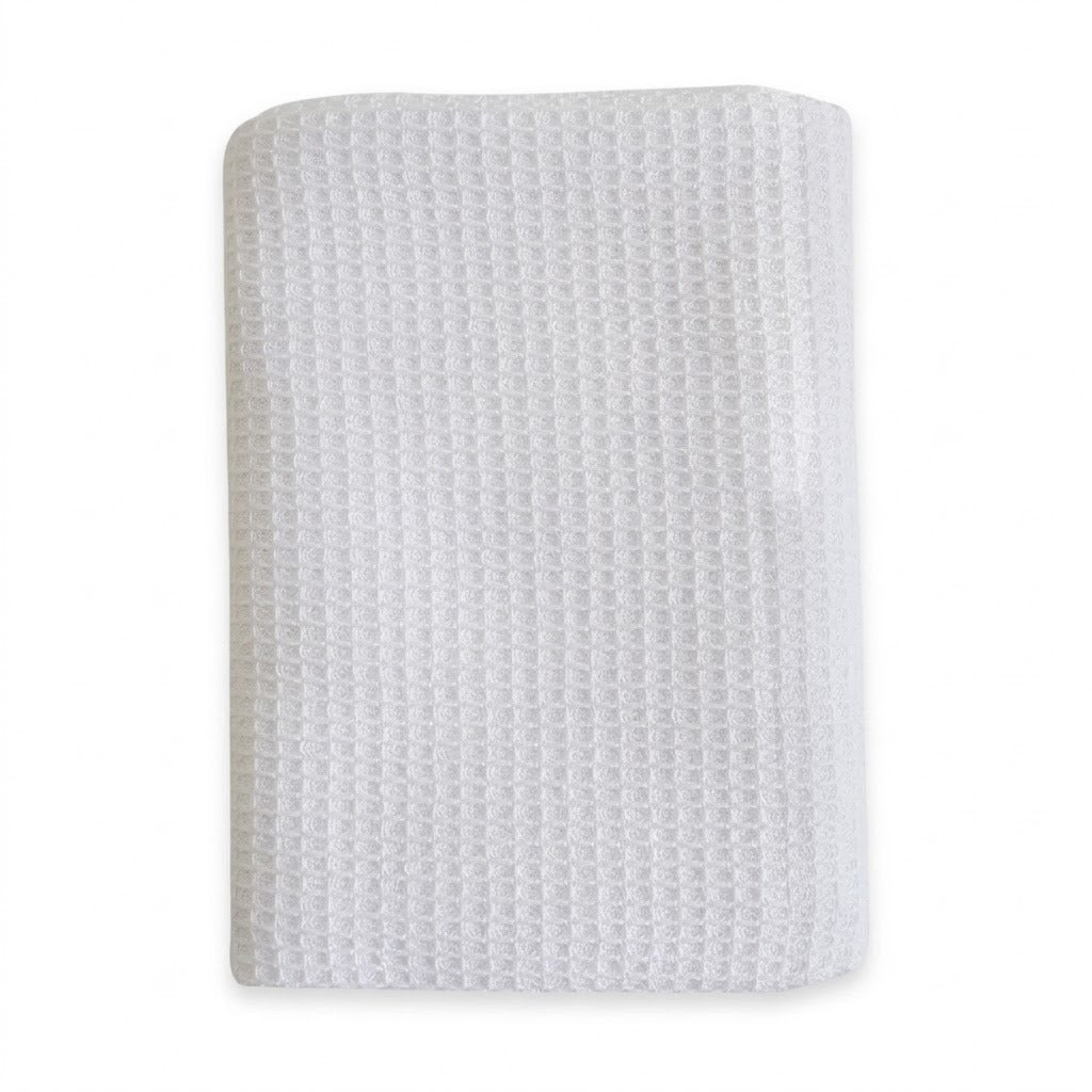 A folded white textured fabric item, likely a baby blanket or swaddle, featuring a waffle or honeycomb pattern, shown on a plain white background.
